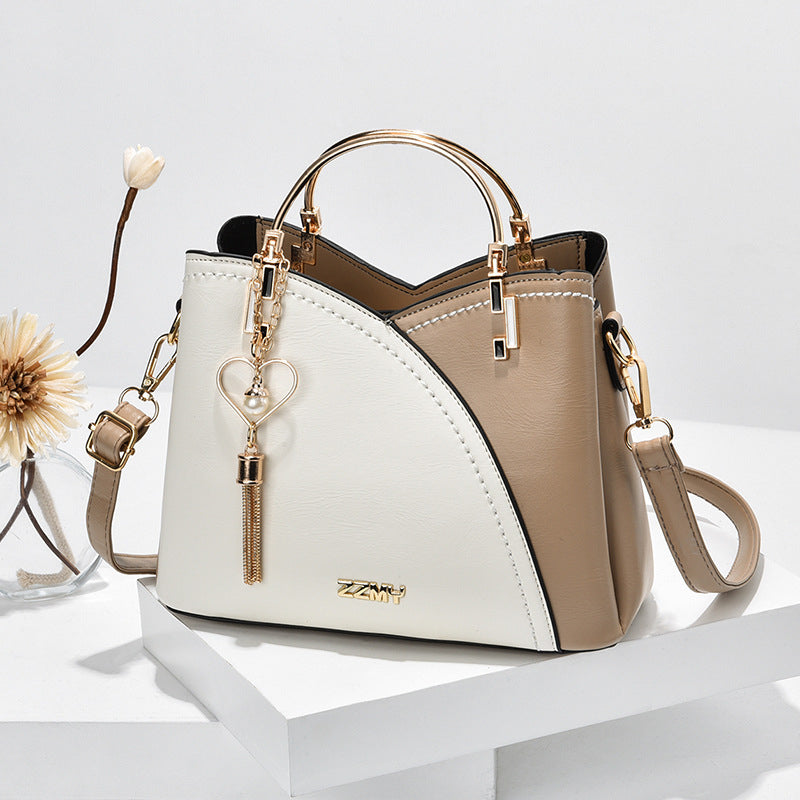 Bolso de mano lujoso con acabado elegante y correa ajustable – LOREVIA