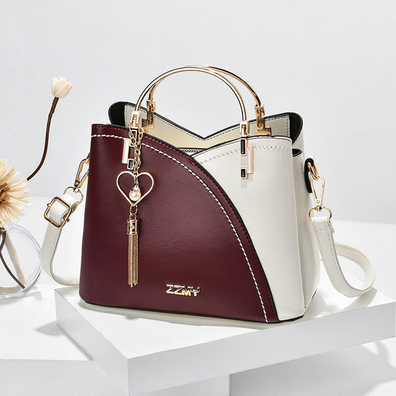 Bolso de mano lujoso con acabado elegante y correa ajustable – LOREVIA